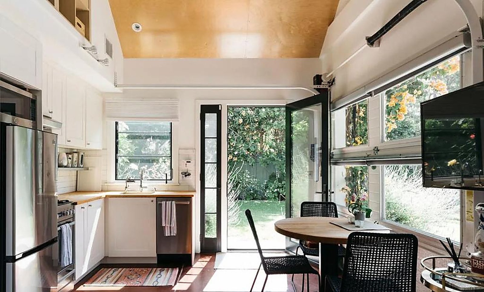 Guest house kitchen with garden view and dining area in Santa Monica furnished rental