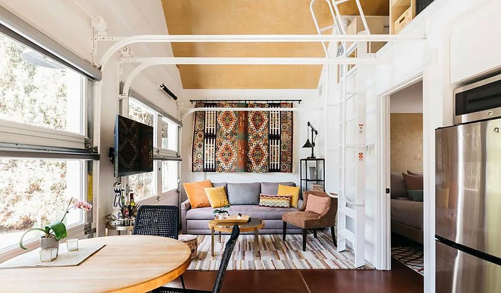 Guest house living room with loft access and bohemian decor in Santa Monica