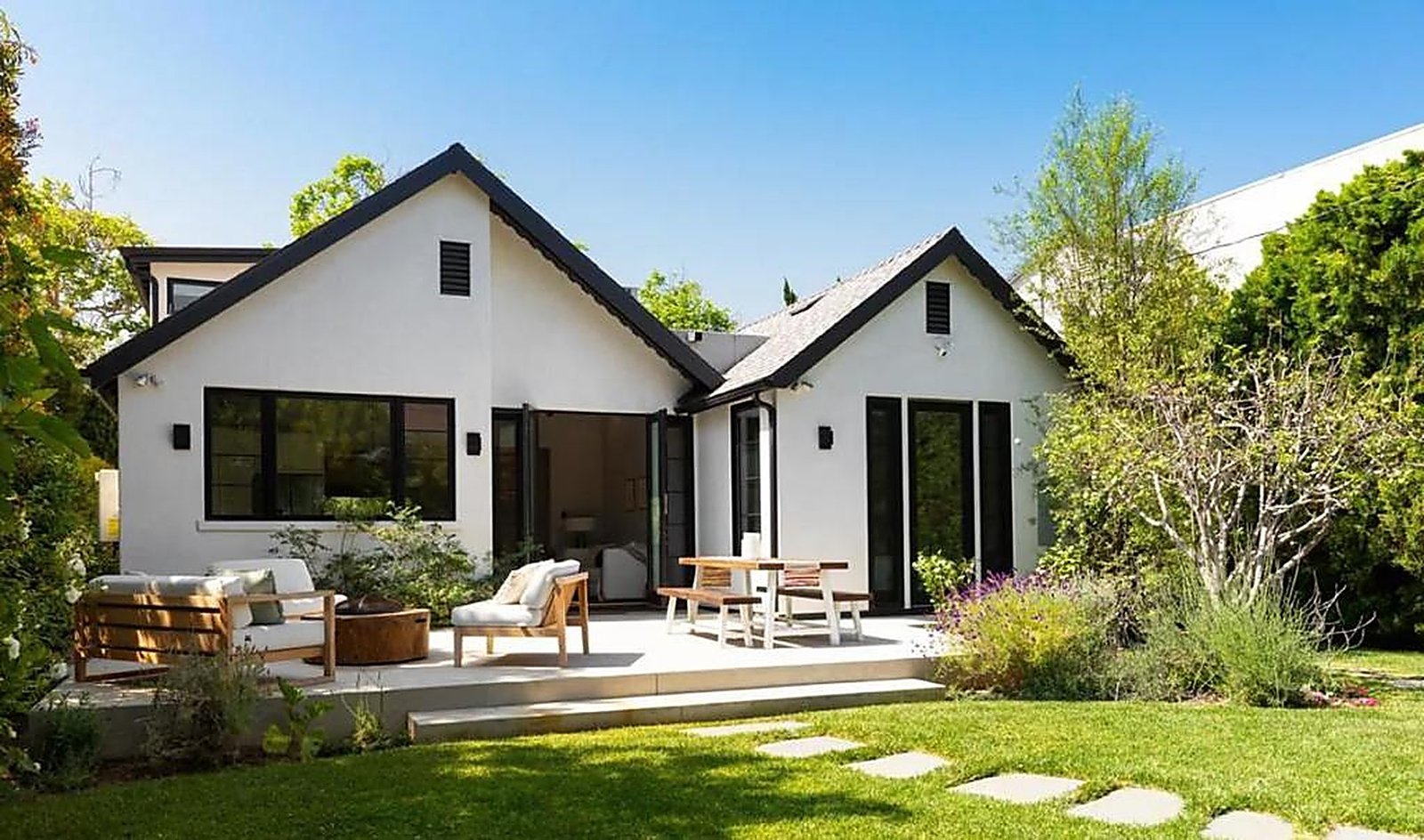 Modern outdoor patio with lounge furniture and landscaped yard in Santa Monica